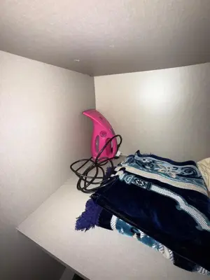 a pink lamp sitting on a shelf next to a bed at Comfort Luxe 2BR Pool & Balcony in Marrakech