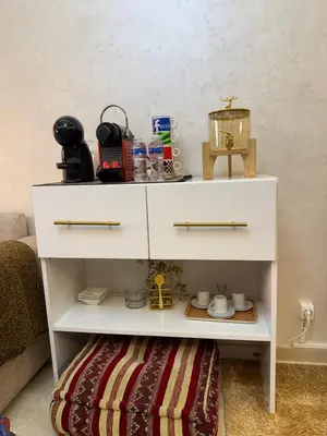 a white dresser with a shelf in a living room at Comfort Luxe 2BR Pool & Balcony in Marrakech