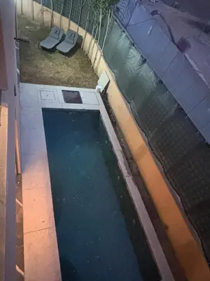 an overhead view of a pool of water next to a fence at Elite garden in Marrakech