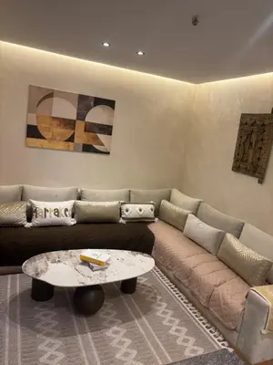 a living room with a couch and a coffee table at Elite garden in Marrakech
