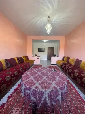a living room with two couches and a table at Majorele in Marrakech
