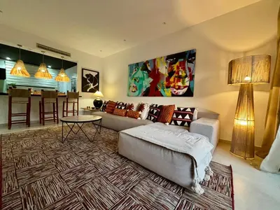 a living room with a couch and a table at Luxury apartment with swimming pool, Hivernage in Marrakech