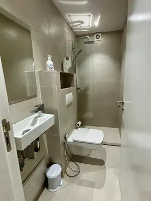 a bathroom with a toilet and a sink and a shower at Luxury apartment with swimming pool, Hivernage in Marrakech