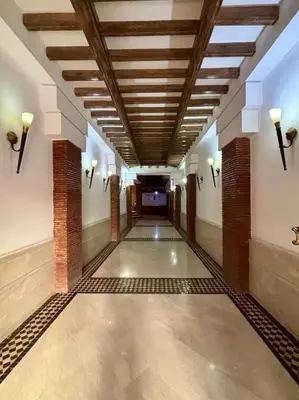 an empty hallway in a building with a ceiling at Luxury apartment with swimming pool, Hivernage in Marrakech