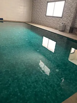 a swimming pool with a white object in the water at appartement vue piscine enjoy & relax in Marrakech