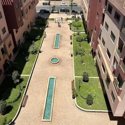 an aerial view of a courtyard between two buildings at appartement vue piscine enjoy & relax in Marrakech