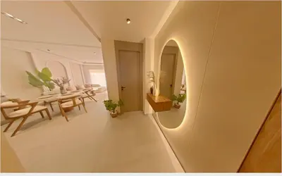 a room with a hallway with a table and a mirror at Appartement chic Menara Mall piscine Rooftop in Marrakech