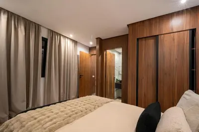 a bedroom with a bed and wooden walls and curtains at NEW !!! Organic design apartment-Center Marrakech getaway in Marrakech
