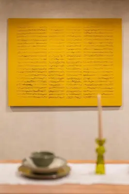 a table with a candle and a yellow picture at NEW !!! Organic design apartment-Center Marrakech getaway in Marrakech