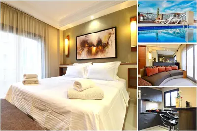 a hotel room with a large bed and a pool at 1 King BR with AC, Roof Pool & View-Perfect for 2- City Center in Marrakech