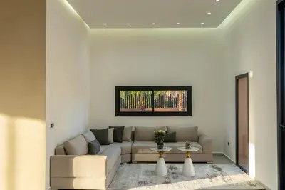 a living room with a couch and a table at Villa Santa Marrakech in Marrakech