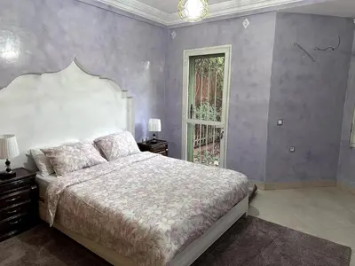 a bedroom with a large bed and a window at Spacious Villa with Private Pool in Oulad Lahsene