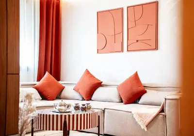 a living room with a couch and a table at Terracotta Stay - Free parking in Marrakech
