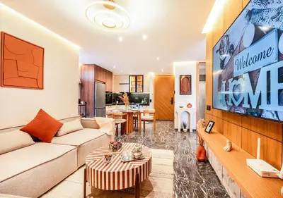 a living room with a couch and a tv at Terracotta Stay - Free parking in Marrakech