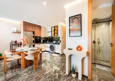 a kitchen and dining room with a table and chairs at Terracotta Stay - Free parking in Marrakech