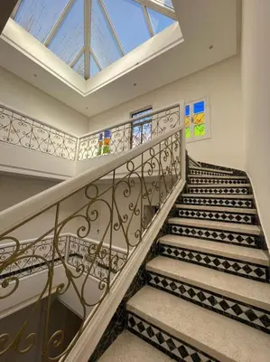 a spiral staircase with a skylight in a house at Riad-style triplex in secure residence in Marrakech