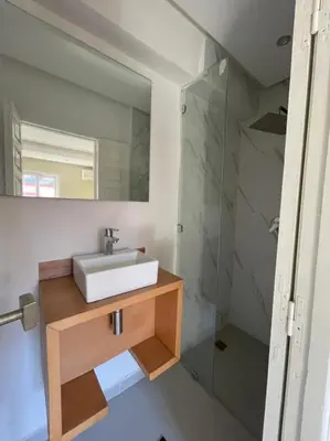 a bathroom with a sink and a mirror at Riad-style triplex in secure residence in Marrakech