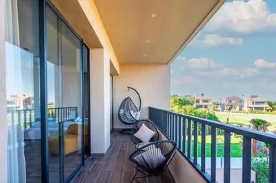 a balcony with a bench and a view at Luxury Villa with Heated Pool & Private cinema in Marrakech