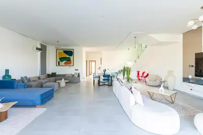 a living room with couches and a blue couch at Luxury Villa with Heated Pool & Private cinema in Marrakech