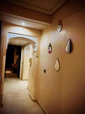 a room with a wall with a bunch of mirrors on it at Guéliz Horizon - Central Apartment in Miramas2 in Marrakech