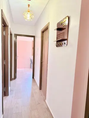 a hallway with white walls and a ceiling at A24 Confortable Moderne Au Centre-ville in Marrakech