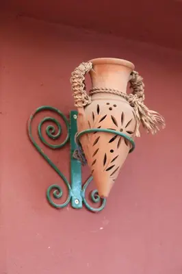 a vase is hanging on a wall at Central terrace XXL - Carré Eden - smart Lock in Marrakech