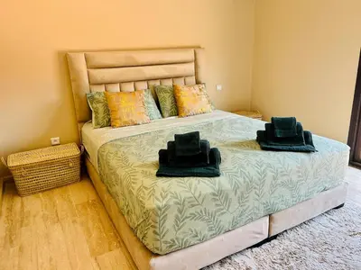 a bedroom with a bed with two hats on it at Villa Dar Ouladi - Marrakech - Pool & Rooftop in Marrakech