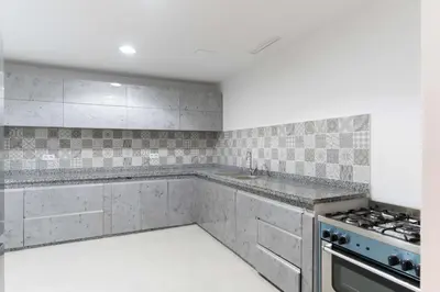 a kitchen with a sink and a stove at Villa Nayma in Marrakech