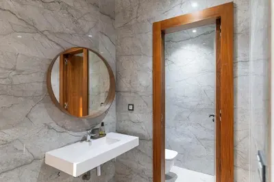 a bathroom with a white sink and a mirror at Villa Nayma in Marrakech