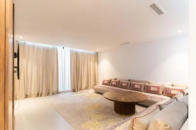 a living room with a couch and a table at Villa Nayma in Marrakech