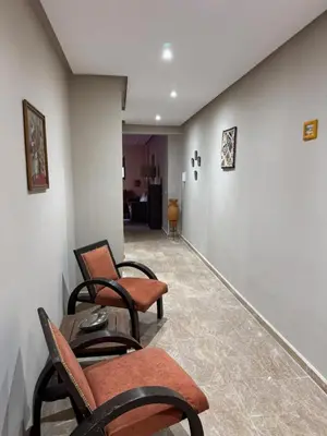 a waiting room with chairs and a table at Opera 3 in Marrakech