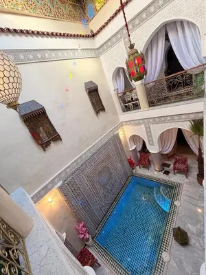 an overhead view of a swimming pool in a building at Riad Mon Pote in Marrakech