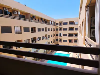 a view from the balcony of a apartment building at Cocoon Apartment & Pool ctm aeropot train station in Marrakech