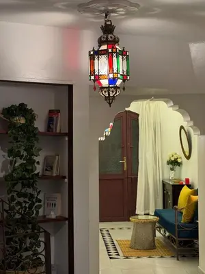 a chandelier hanging from a ceiling in a room at Riad LK25 in Marrakech