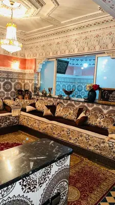 a living room with a couch and a window at Appartement in Marrakech
