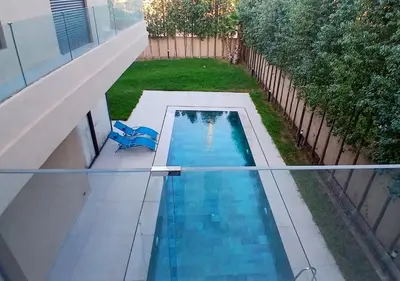 an overhead view of a swimming pool in a backyard at Villa Soleil Couchant in Marrakech
