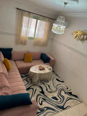 a living room with a couch and a table at My Marrakesh - G Floor in Marrakech