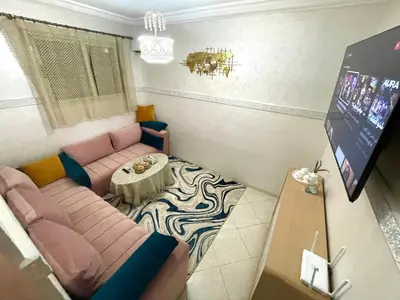 a living room with a couch and a table at My Marrakesh - G Floor in Marrakech