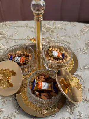 a table with three containers of snacks and a spoon at My Marrakesh - G Floor in Marrakech