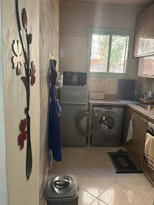a small kitchen with a washing machine and a washer at My Marrakesh - G Floor in Marrakech