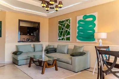a living room with a couch and a table at Modern Marrakech Garden Retreat Pool & Balcony in Marrakech