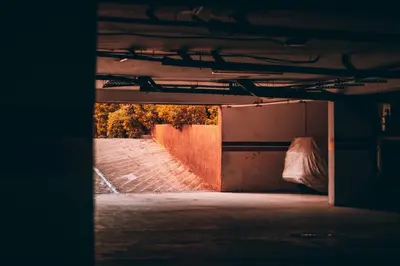 an open garage with a brick wall and a ramp at Modern Marrakech Garden Retreat Pool & Balcony in Marrakech