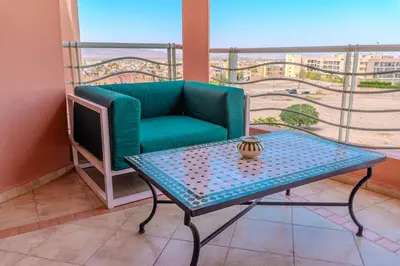 a living room with a couch and a table at Modern Marrakech Garden Retreat Pool & Balcony in Marrakech