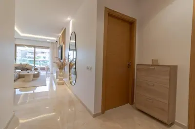 a hallway with a door and a living room at Marrakech prestigia in Marrakech
