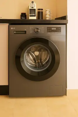 a washing machine sitting in a kitchen at Ground floor 2 elegant bedrooms with direct pool access in Marrakech