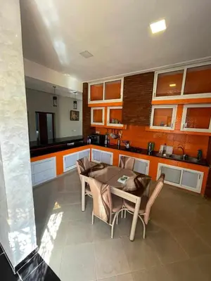 a kitchen with a table and chairs in a room at Villa Elbidaoui in Marrakech