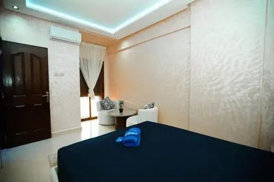 a room with a bed with a blue shoe on it at New apartment rental in Marrakech