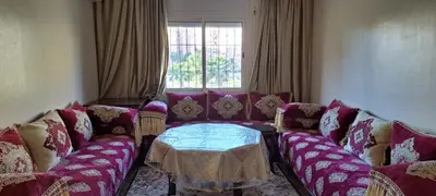 a living room with a couch and a table at Menara Amandier in Marrakech
