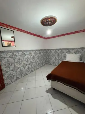 a bedroom with a bed and a ceiling at hostel Daryusssef114 in Marrakech