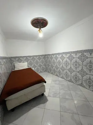 a bedroom with a bed and a ceiling at hostel Daryusssef114 in Marrakech